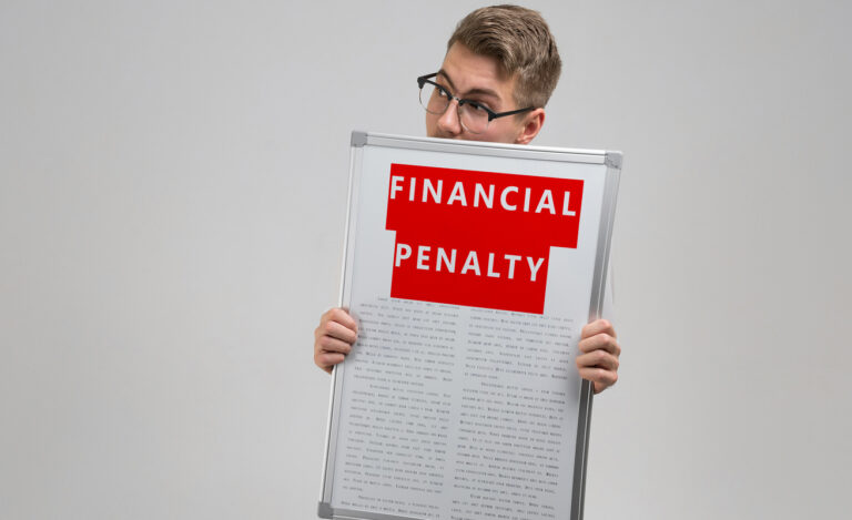 Young man keeps in front of him a poster with the financial penalty is isolated on a light background